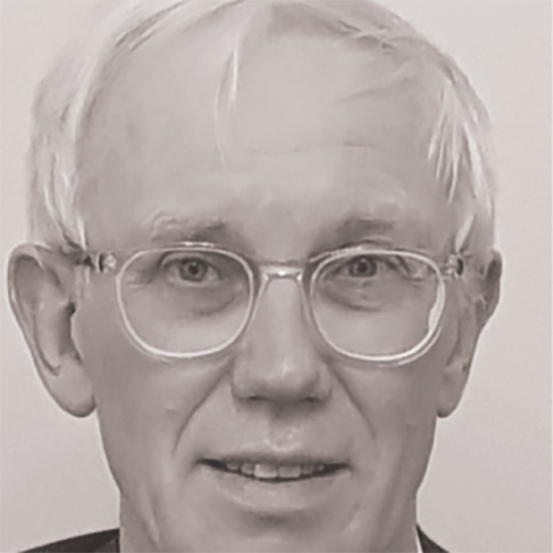 Portrait headshot photograph of Prof Ray Donnelly smiling