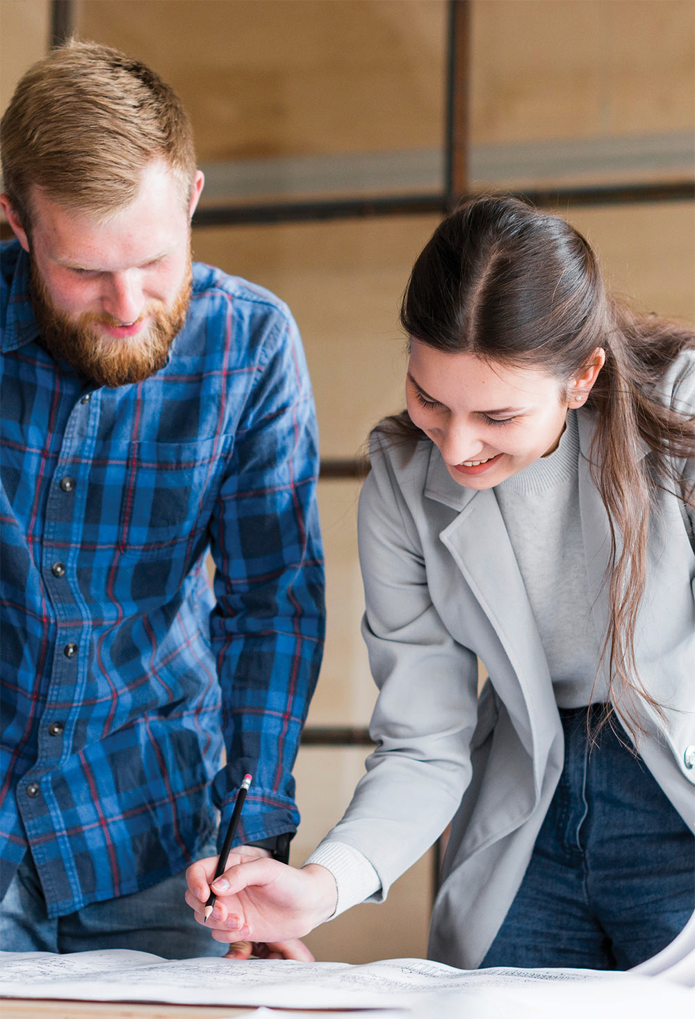 Employees looking over papers on table